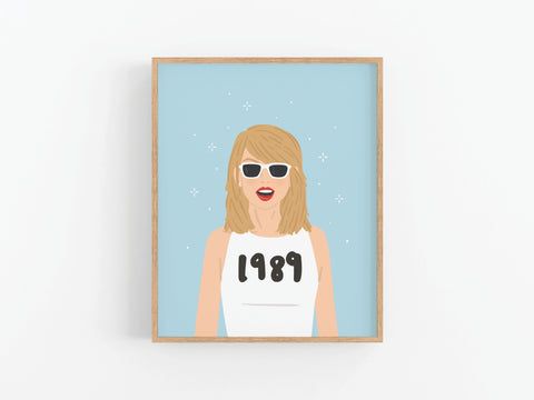 The TS 1989 Art Print by Onderkast Studio features a blonde woman in white sunglasses and a 1989 top on a sparkly light blue background, perfect as pop era wall art inspired by Taylor Swifts album art.