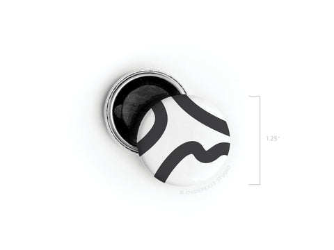 The Onderkast Studio Abstract No. 3 Button Magnet – DISCONTINUED is a round, black-and-white magnet with abstract curved lines, shown beside its open back and a 1.25-inch diameter measurement. Proudly made in the USA.