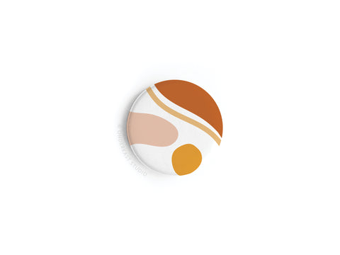 The Abstract No. 5 Button Magnet by Onderkast Studio features curved shapes in brown, beige, peach, and mustard on white. High-quality craftsmanship; shown on a clean white surface. This item is discontinued.