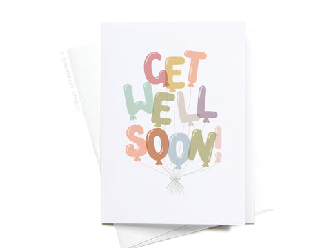 The Get Well Soon Balloons Folded Greeting Note Set of 10 by Onderkast Studio features premium cards with pastel balloon letters spelling “GET WELL SOON!” and playful strings on a crisp white background.