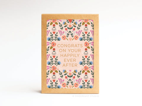 The Happily Ever After Floral Folded Greeting Note Set of 10 by Onderkast Studio features colorful floral designs and Congrats on your happily ever after on premium card stock. Printed in the USA, these cards stand upright with a light background.