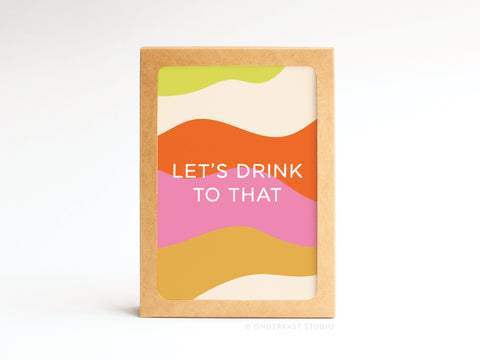 The Let’s Drink to That Folded Greeting Note Set of 10 by Onderkast Studio features a premium card with wavy green, orange, pink, and yellow shapes and “LETS DRINK TO THAT” in white text on the front.