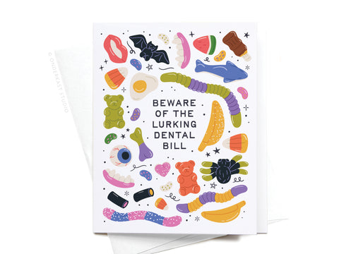 The Beware of the Lurking Dental Bill Greeting Card by Onderkast Studio displays fun candies, treats, and dental items around a bold warning—a humorous Halloween card for your spooky greetings.