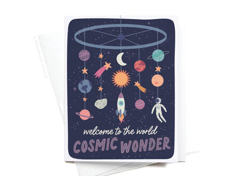 The Welcome to the World Cosmic Wonder Greeting Card by Onderkast Studio features a baby mobile with planets, stars, a rocket, astronaut, sun, and moon on a dark starry background with the message welcome to the world COSMIC WONDER.
