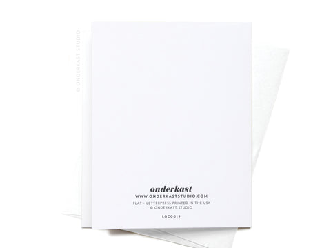 A white Onderkast Studio sheet with onderkast and website info in black at the bottom, partially covering a matching envelope—ideal for presenting the Longest One Night Stand Ever Letterpress Greeting Card.