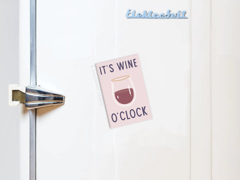 A white fridge with a retro handle and the word Elektrosvit on top features the Onderkast Studio It’s Wine O’clock Refrigerator Magnet, showing a glass of red wine—an ideal kitchen decor piece or gift for wine lovers.