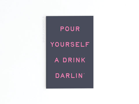 The Pour Yourself a Drink Darlin’ Refrigerator Magnet by Onderkast Studio features pink text on dark gray, perfect for adding a fun touch to your kitchen decor.