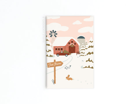 The Christmas Tree Farm Refrigerator Magnet by Onderkast Studio features a red barn, silo, vintage truck, windmill, snow-covered trees, and a brown rabbit under a pink sky—adding rustic holiday charm to your fridge.