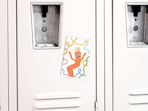 The Onderkast Studio Wacky Waving Inflatable Tube Man Refrigerator Magnet—a bright, cartoonish orange figure—adds a cheerful touch to a beige locker, standing out among plain lockers.
