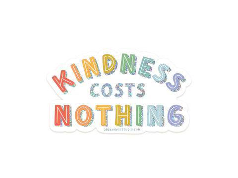 Brighten any surface with the Onderkast Studio Kindness Costs Nothing Glitter Sticker, featuring glitter vinyl letters on a white background. The rainbow-colored kindness and nothing stand out, and weatherproof vinyl ensures long-lasting use.