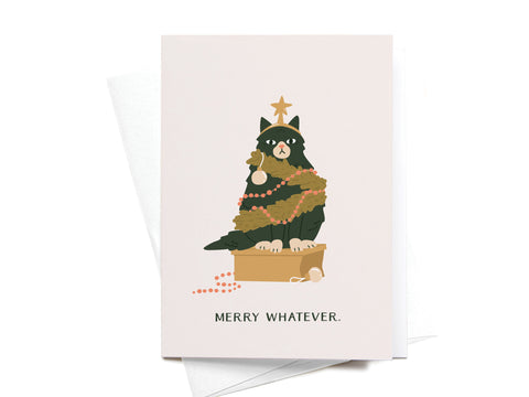The Merry Whatever Cat Folded Greeting Note Set of 10 by Onderkast Studio features a grumpy cat tangled in Christmas lights on a box with a star, printed in vibrant colors. “MERRY WHATEVER” is printed below the illustration.