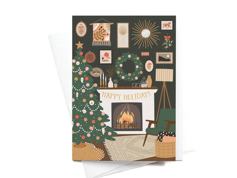 The Happy Holidays Cozy Fire Folded Greeting Note Set of 10 by Onderkast Studio features a vibrantly illustrated Christmas tree, lit fireplace with a Happy Holidays banner, wreaths, gifts, and cozy decor—perfect festive greeting note cards.