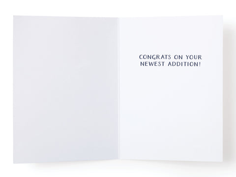 The OMG! Enjoy Eating for 2 Greeting Card – FINAL STOCK by Onderkast Studio features CONGRATS ON YOUR NEWEST ADDITION! on the right, with a blank left side—a premium card, perfect for expecting parents.