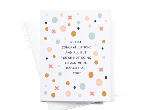 The Don’t Ask Me to Babysit Greeting Card by Onderkast Studio features colorful dots and X marks, reading: “So like… congratulations and all but you’re not going to ask me to babysit, are you?” Includes a white envelope.