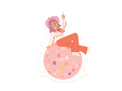 The Disco Cowgirl Sticker by Onderkast Studio features a figure in a pink cowboy hat and western outfit sitting on a large pink disco ball with stars and sparkles. This durable vinyl sticker adds flair to any surface.
