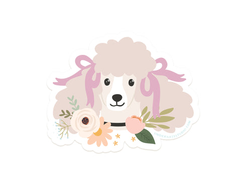 The Poodle Floral Sticker by Onderkast Studio features a fluffy poodle with pink bows and a peach-and-cream floral neckpiece, vibrantly printed on durable vinyl—perfect for adding cute charm anywhere.