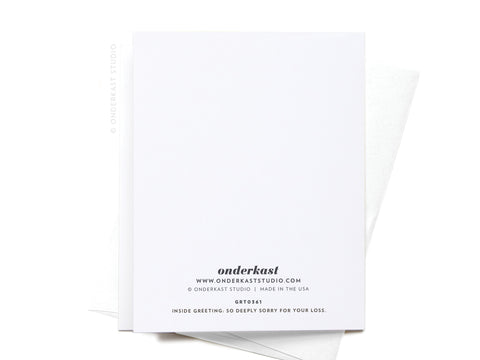 A blank white “Dear Sweet Baby” miscarriage greeting card by Onderkast Studio is shown back-up, featuring the comforting words “SO DEEPLY SORRY FOR YOUR LOSS” and a partially visible envelope underneath.