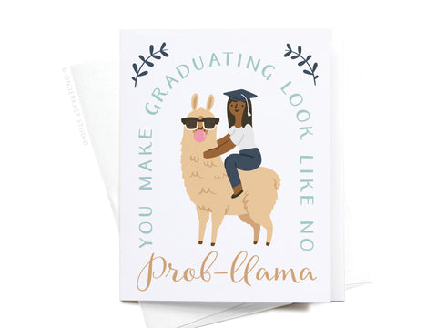 Celebrate their big achievement with the No Prob-llama Greeting Card – FINAL STOCK by Onderkast Studio, featuring a girl in a cap riding a sunglasses-wearing llama and the message, “You make graduating look like no prob-llama.”.