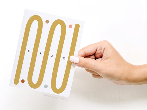 a hand holding a card with the number 100 on it